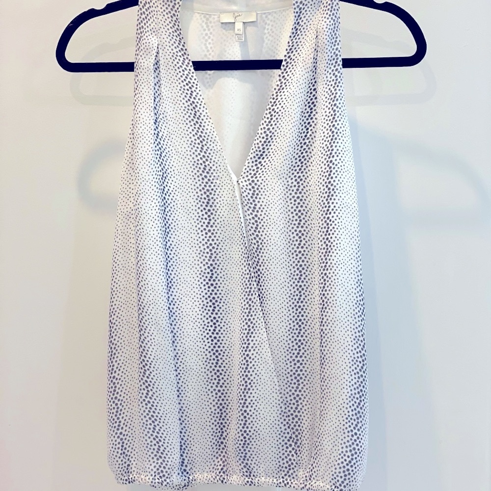 Sleeveless silk Joie top , white with black dots.